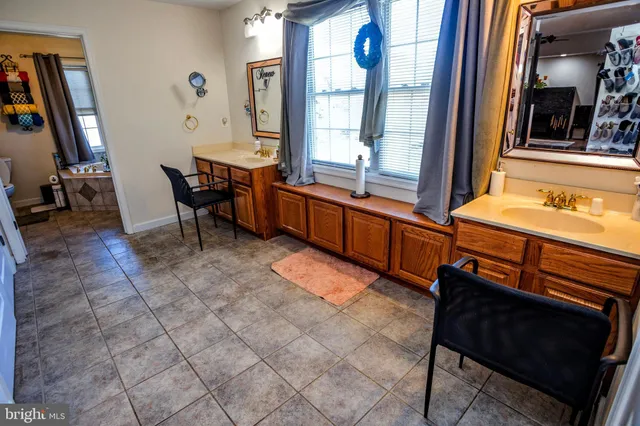 a room with furniture a window and a chandelier