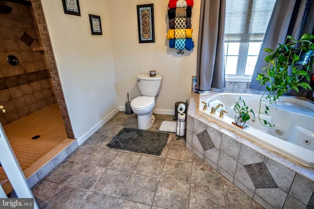 a bathroom with a sink a toilet and bathtub