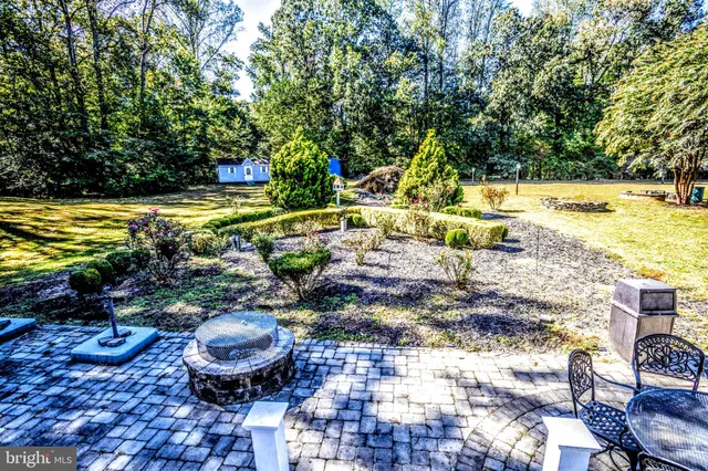 a view of a swimming pool with an outdoor space and seating area