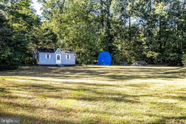 a view of a swimming pool with a yard