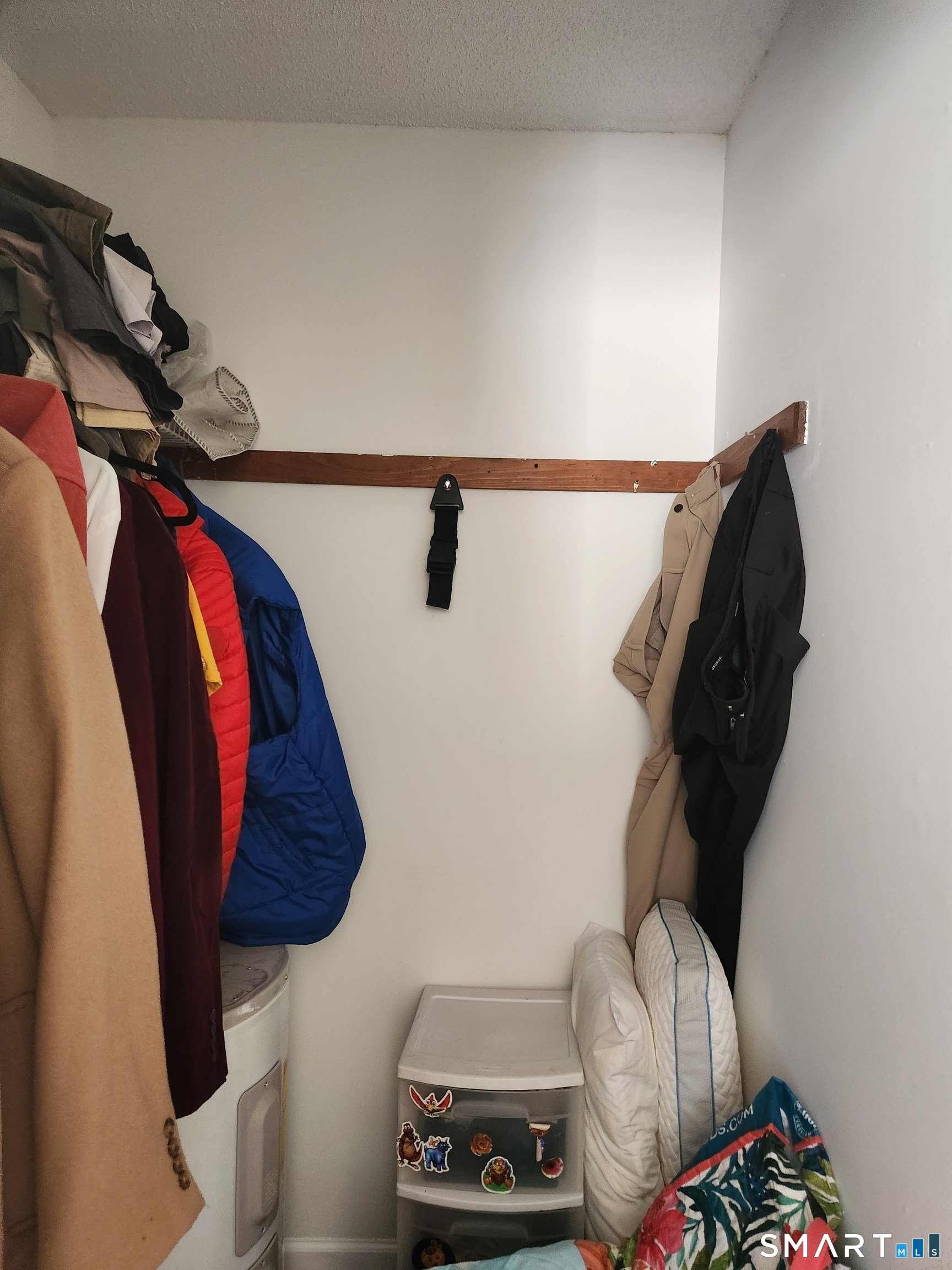 91 4th Street, Unit 7 Ansonia, CT 06401 - Photo 11 of 15 a view of walk in closet with clothes and shoes