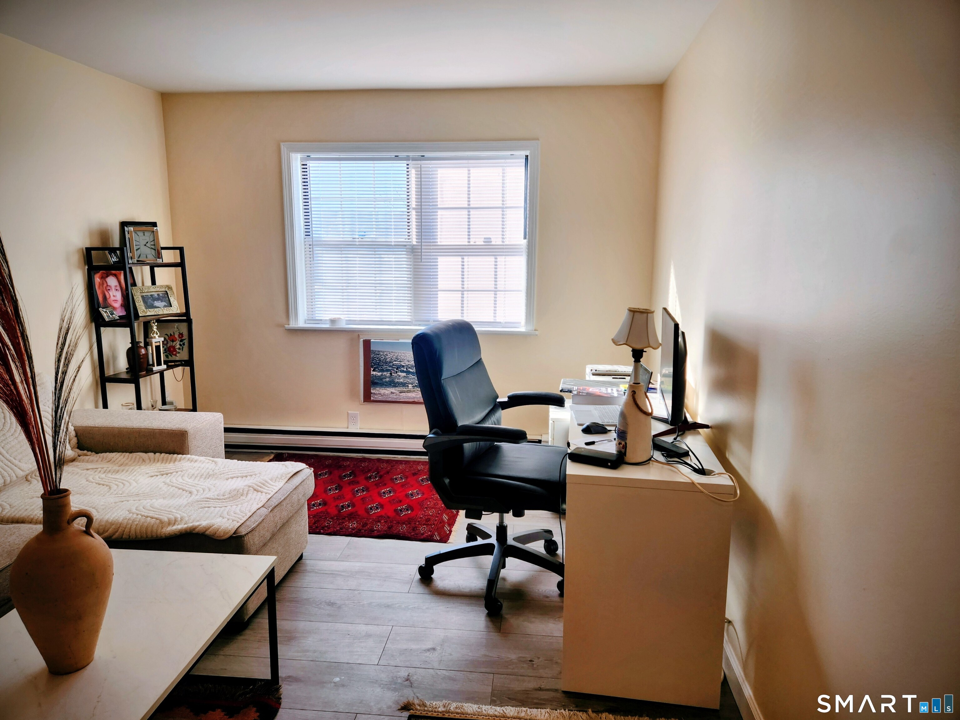91 4th Street, Unit 7 Ansonia, CT 06401 - Photo 2 of 15 a living room with furniture and a window