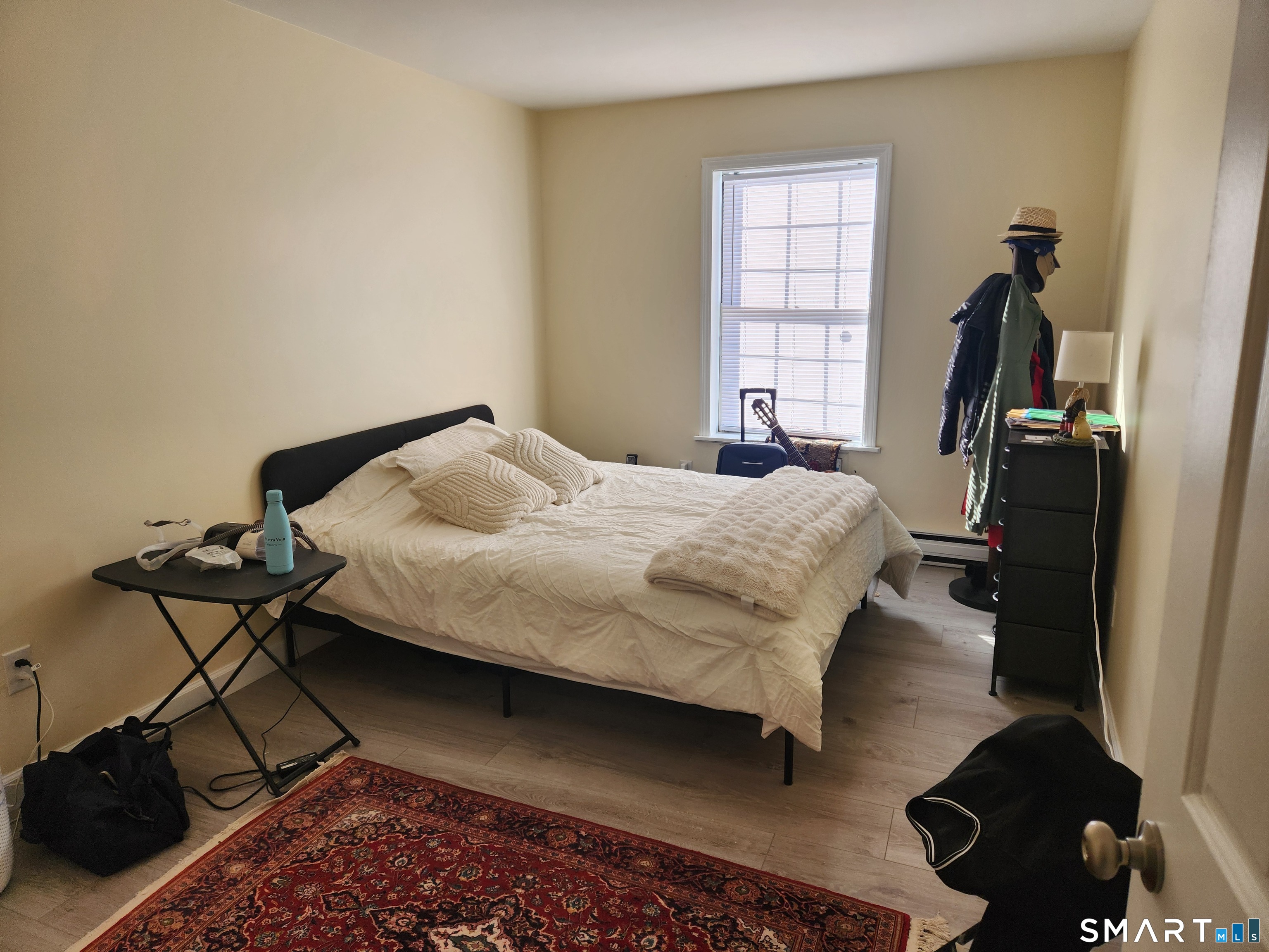 91 4th Street, Unit 7 Ansonia, CT 06401 - Photo 10 of 15 a bedroom with a bed and a window