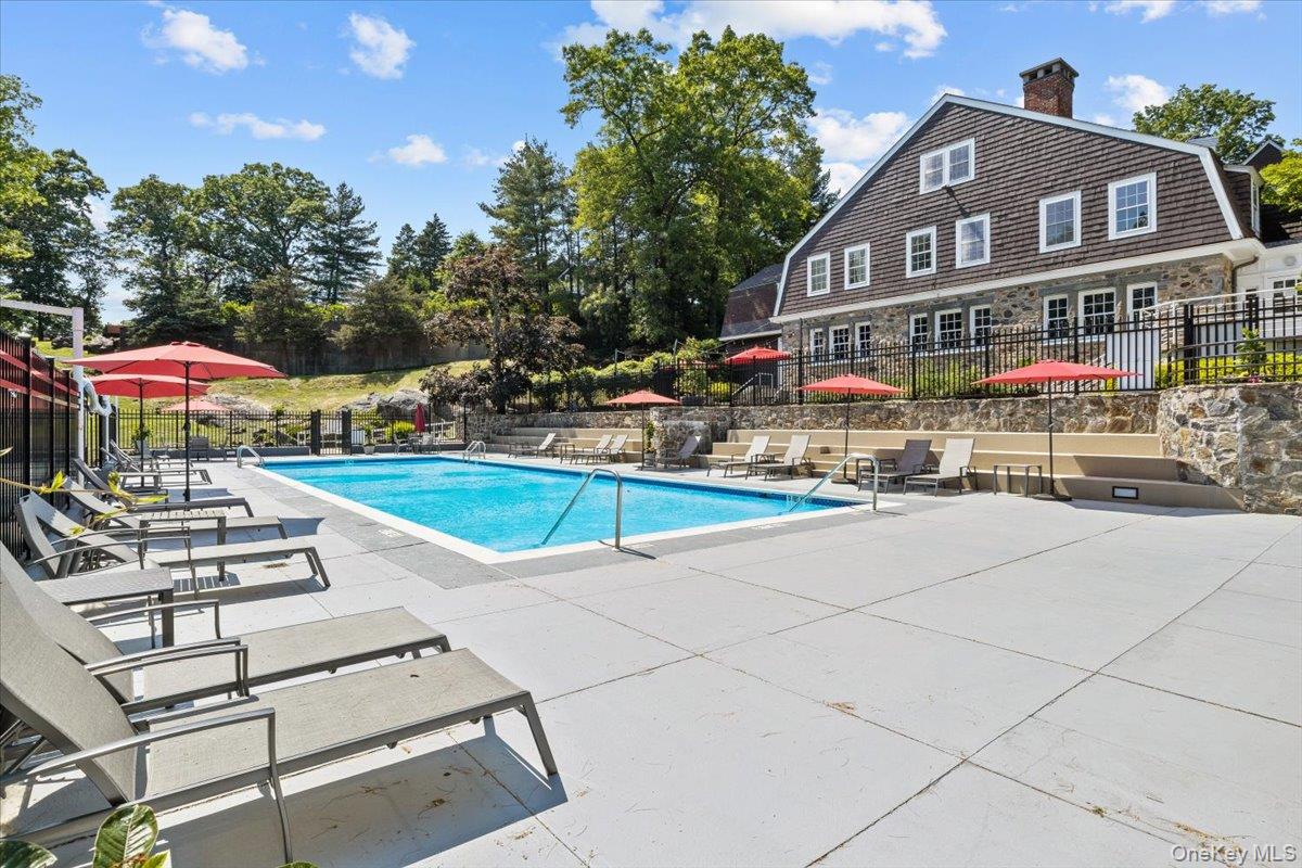 10 Old Jackson Avenue, Unit 72 Hastings-on-Hudson, NY 10706 - Photo 30 of 42 Community pool with a patio and view of scattered trees
