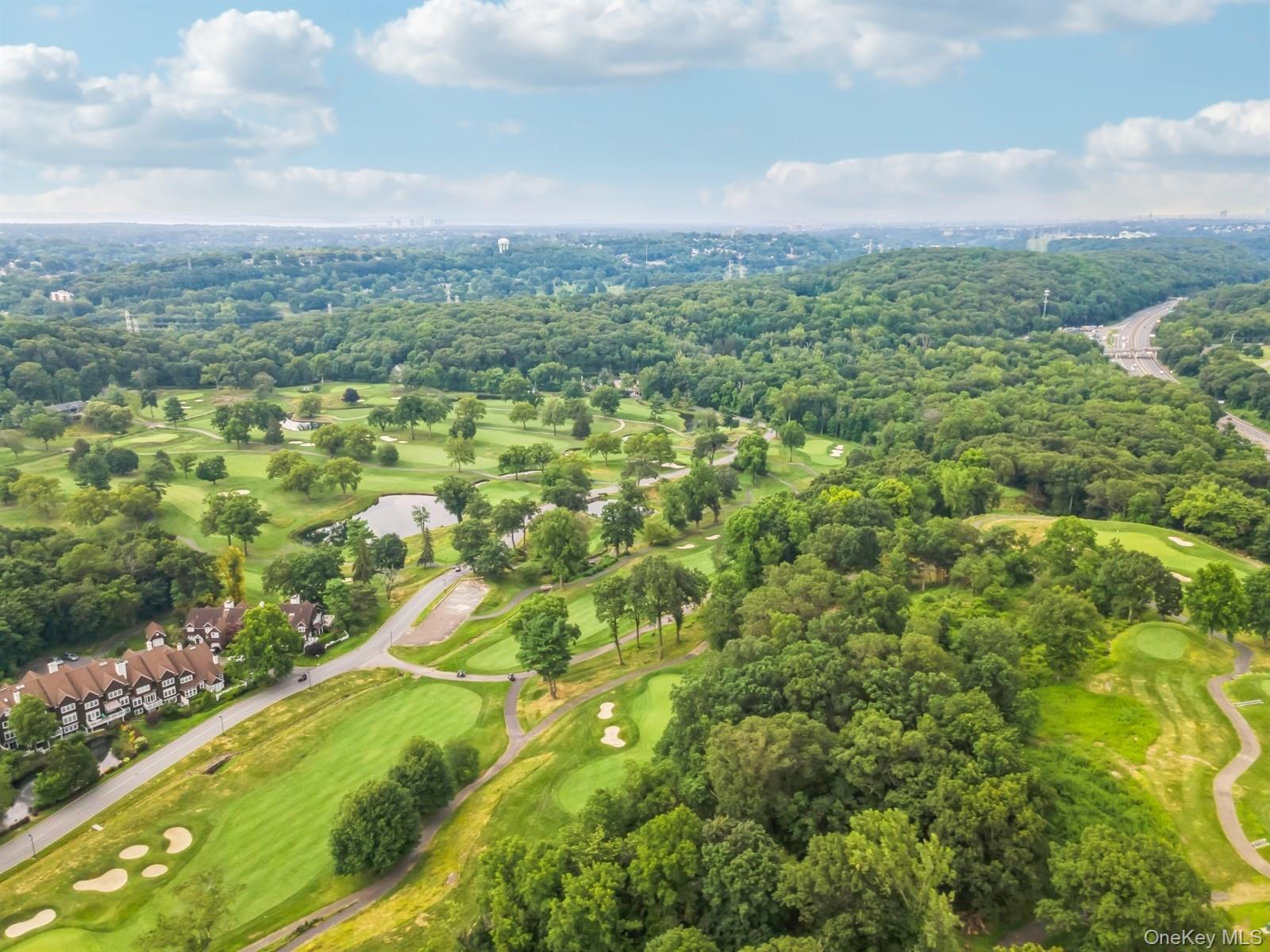 10 Old Jackson Avenue, Unit 72 Hastings-on-Hudson, NY 10706 - Photo 38 of 42 Drone / aerial view of St. Andrew's Golf Course and a tree filled landscape