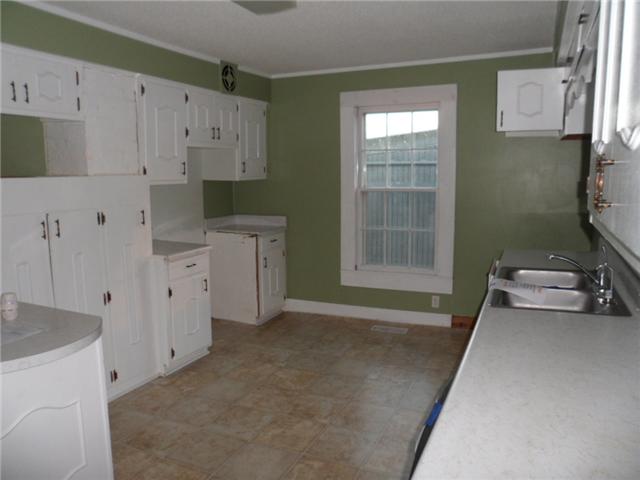 378 Lake Logan Road Ardmore, TN 38449 - Photo 7 of 14 a room with window and white cabinets
