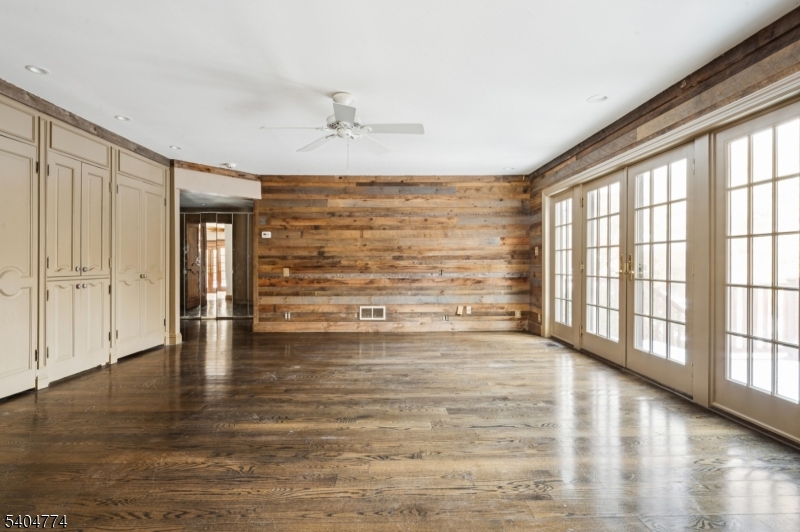 303 Mendham Road Bernardsville, NJ 07924 - Photo 15 of 45 a view of an empty room with wooden floor and a window