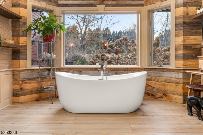 303 Mendham Road Bernardsville, NJ 07924 - Photo 20 of 45 a white bath tub sitting in front of a window