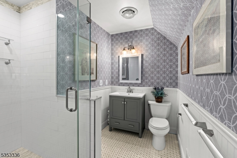 303 Mendham Road Bernardsville, NJ 07924 - Photo 24 of 45 a bathroom with a toilet sink and mirror