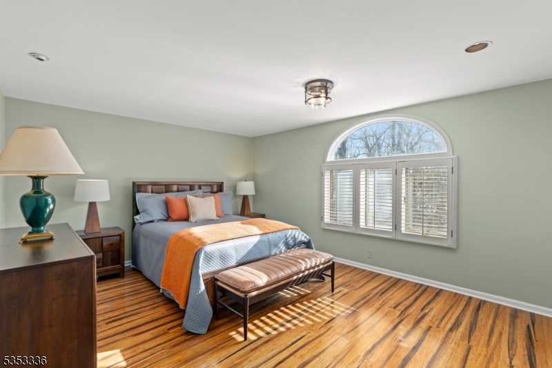 303 Mendham Road Bernardsville, NJ 07924 - Photo 27 of 45 a bedroom with a bed and wooden floor