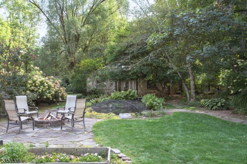 303 Mendham Road Bernardsville, NJ 07924 - Photo 33 of 45 a view of a table and chairs in the garden
