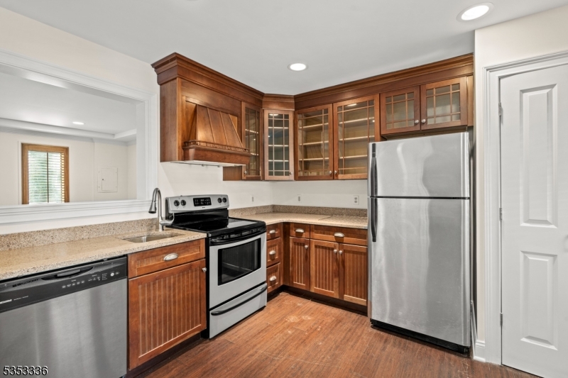 303 Mendham Road Bernardsville, NJ 07924 - Photo 34 of 45 a kitchen with stainless steel appliances granite countertop a refrigerator a stove a sink and a microwave