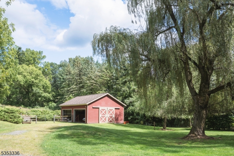 303 Mendham Road Bernardsville, NJ 07924 - Photo 37 of 45 a front view of a house with garden