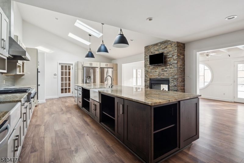 303 Mendham Road Bernardsville, NJ 07924 - Photo 9 of 45 a kitchen with stainless steel appliances granite countertop a stove and a sink