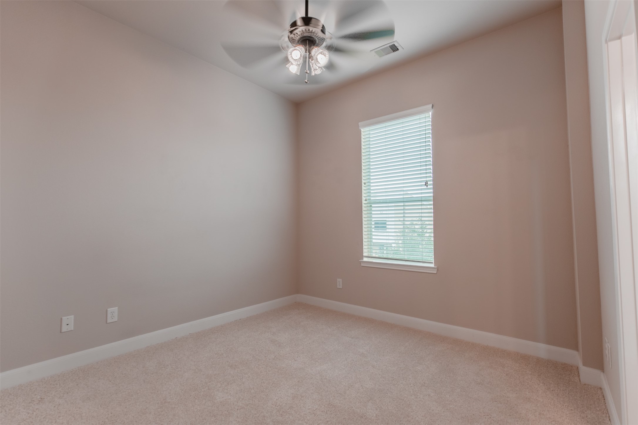 2354 Bastrop Street Houston, TX 77004 - Photo 16 of 21 an empty room with a window and a fan