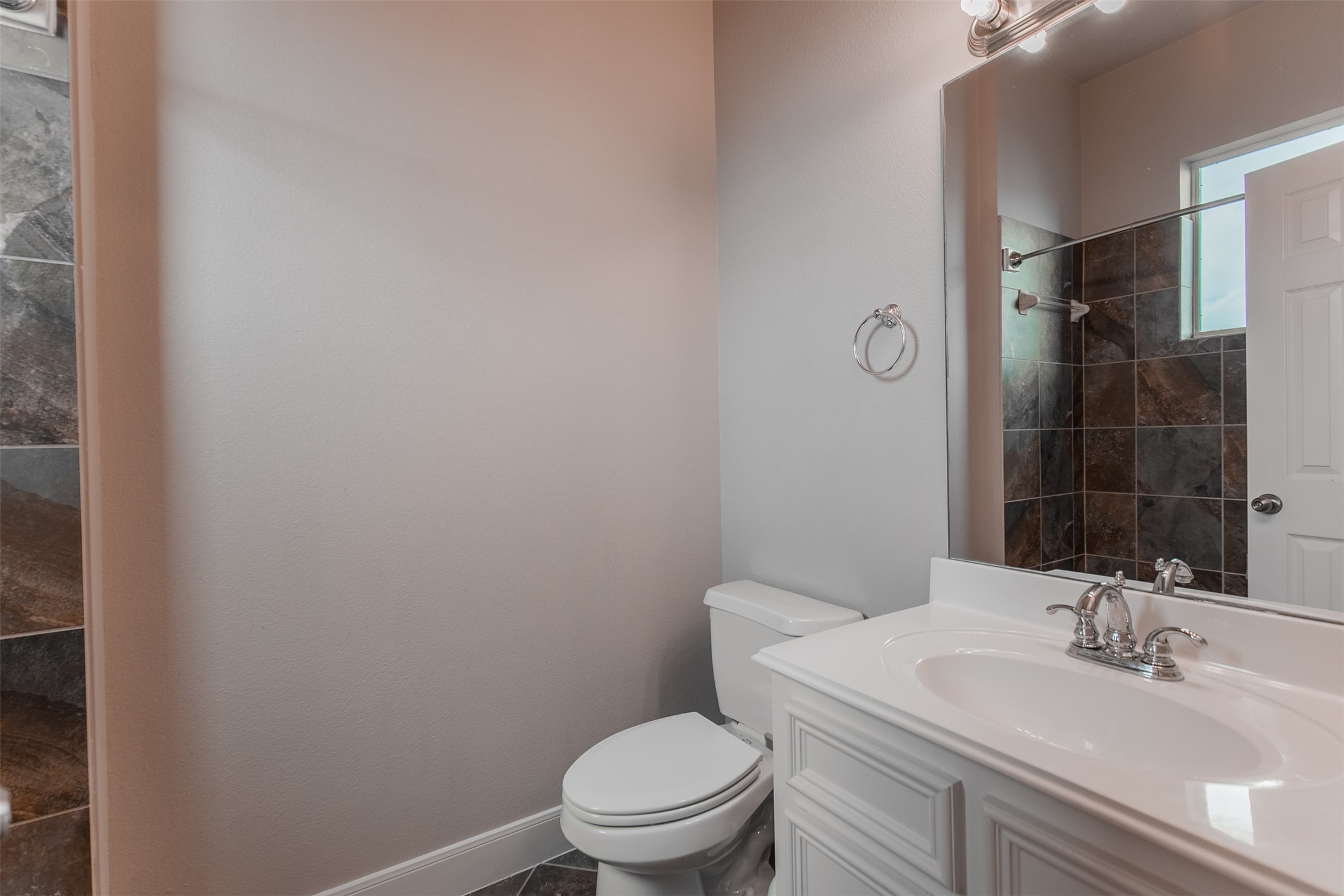 2354 Bastrop Street Houston, TX 77004 - Photo 18 of 21 a bathroom with a sink a toilet and a mirror