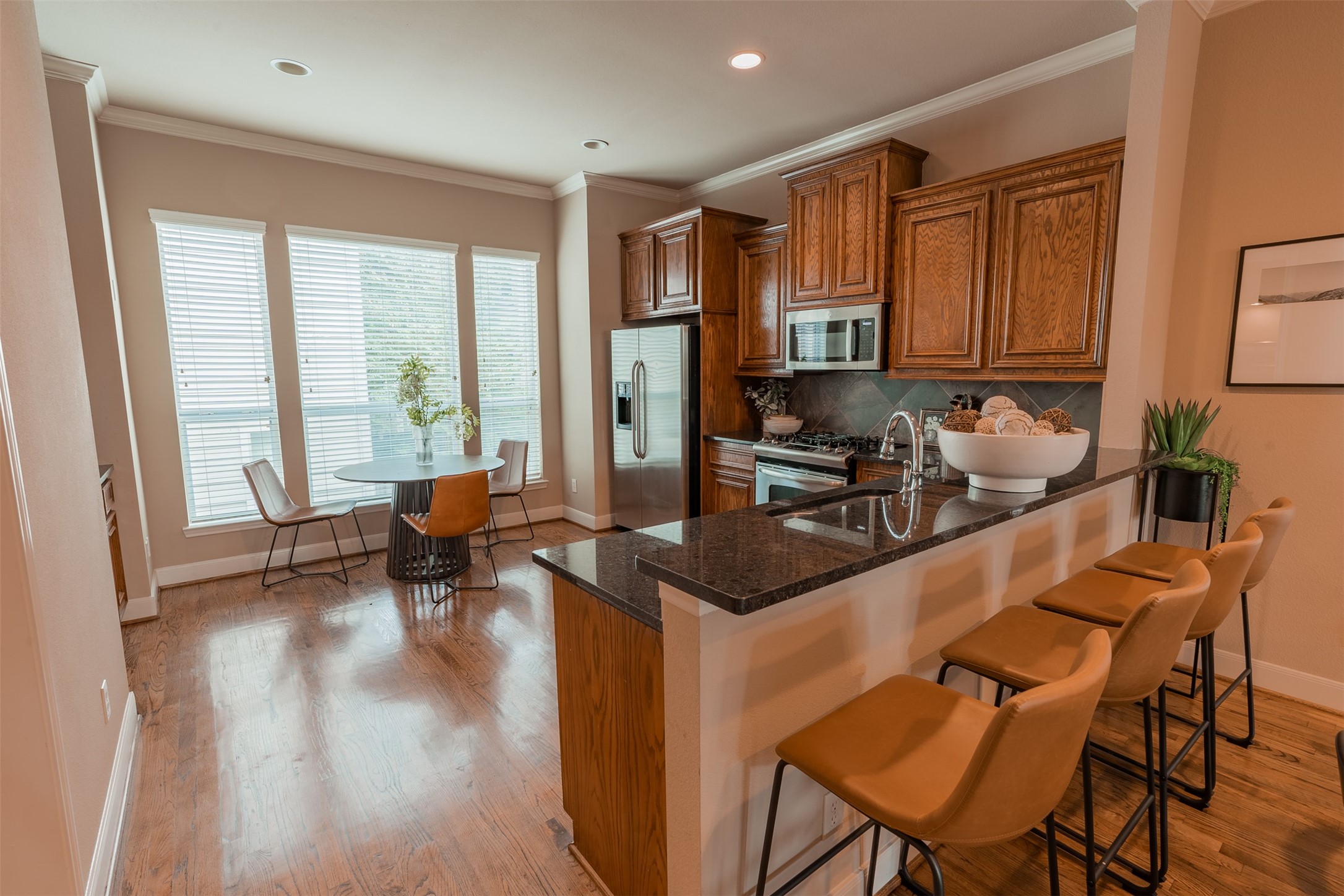 2354 Bastrop Street Houston, TX 77004 - Photo 5 of 21 a kitchen with a stove a refrigerator and wooden floor