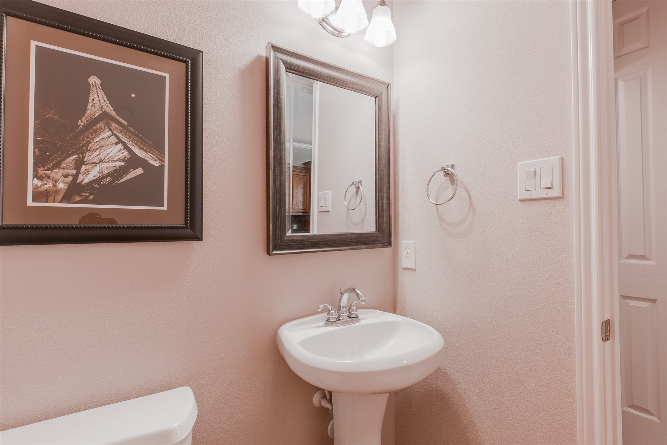 2354 Bastrop Street Houston, TX 77004 - Photo 9 of 21 a bathroom with a toilet sink and mirror