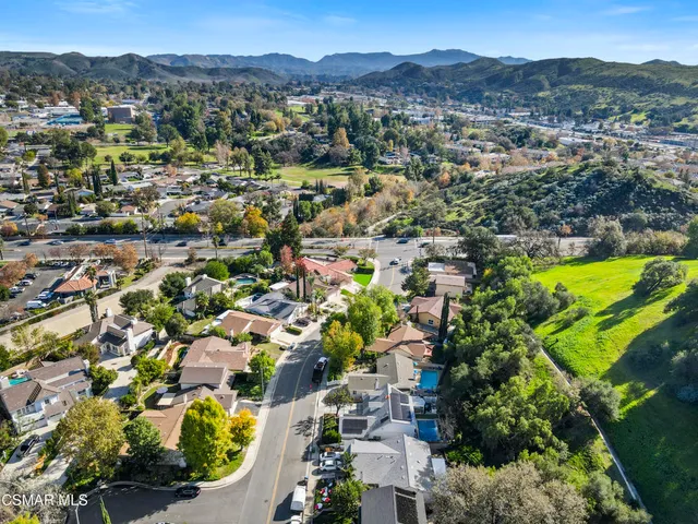 an aerial view of residential building and trees
