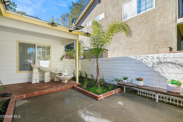 a backyard of a house with seating space
