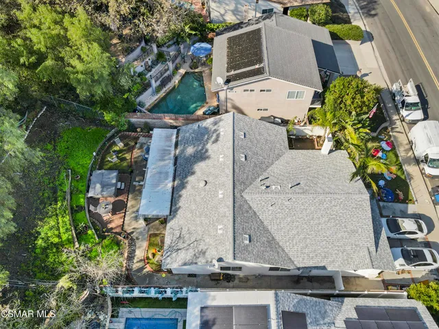 an aerial view of multiple houses with outdoor space
