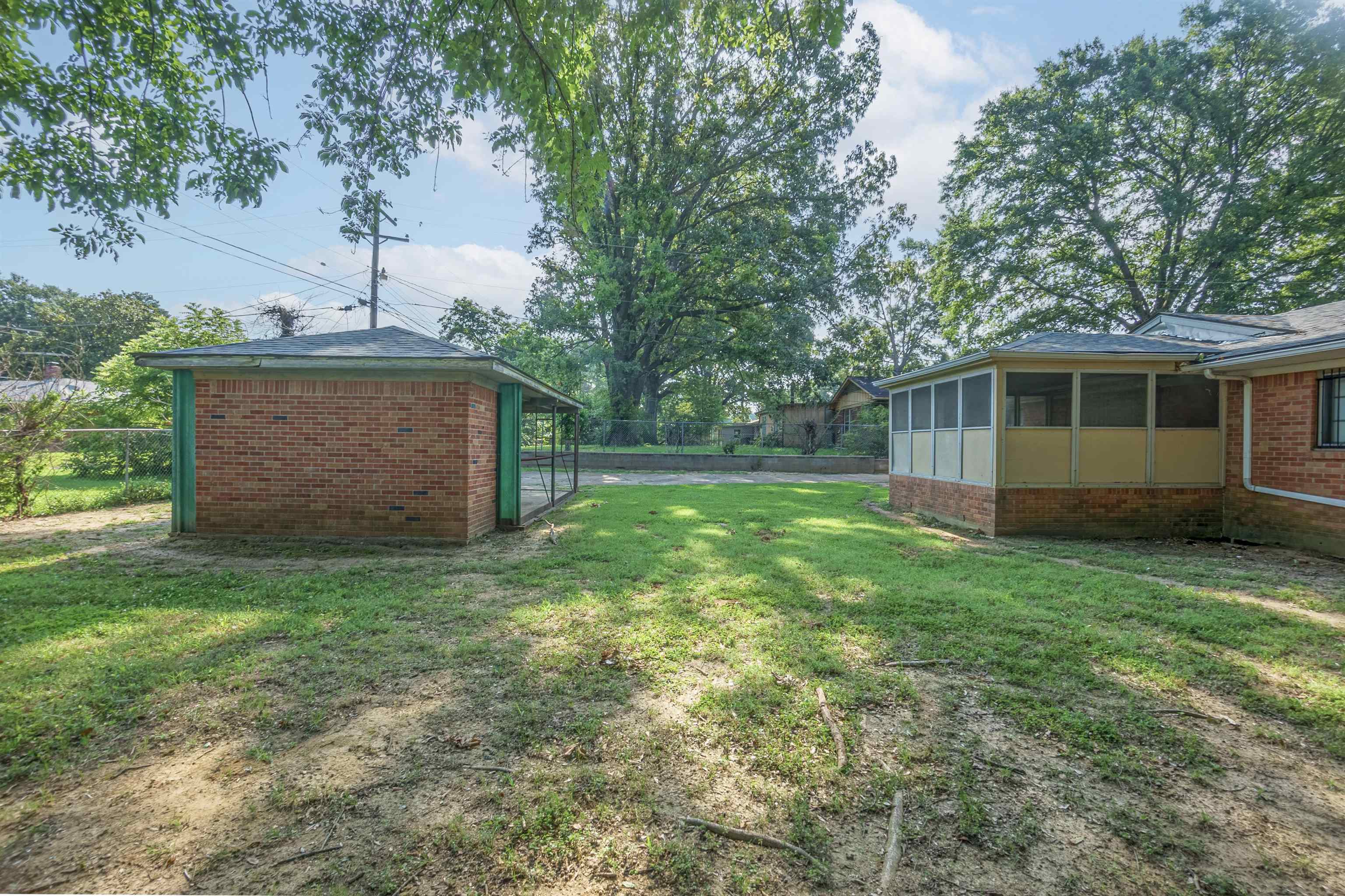 436 Clower Road Memphis, TN 38109 - Photo 22 of 22 View of yard with a sunroom