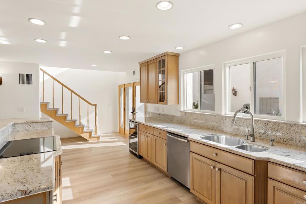 219 Via Osuna Rancho Santa Fe, CA 92091 - Photo 15 of 50 a view of a kitchen with a sink and a large window