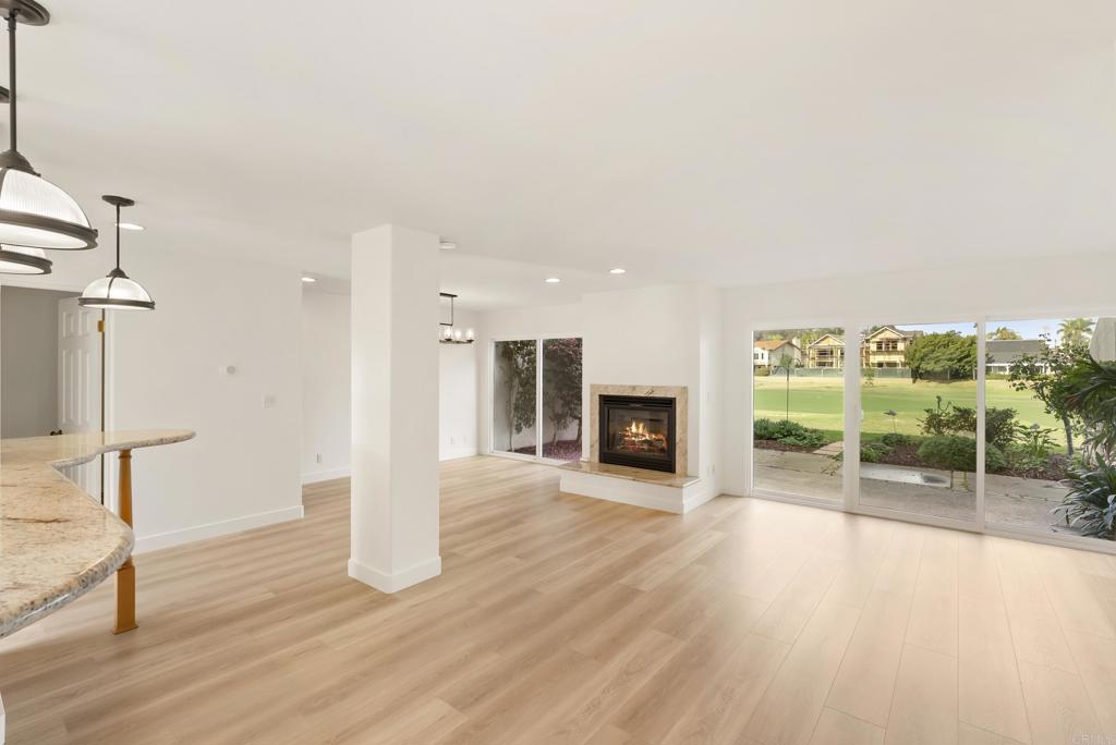 219 Via Osuna Rancho Santa Fe, CA 92091 - Photo 17 of 50 a view of a livingroom with wooden floor and fireplace