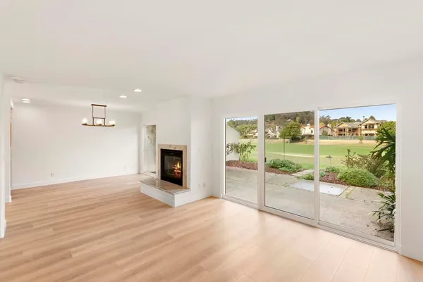 a view of a kitchen with kitchen island and a sink