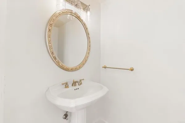 a view of a room with a ceiling fan