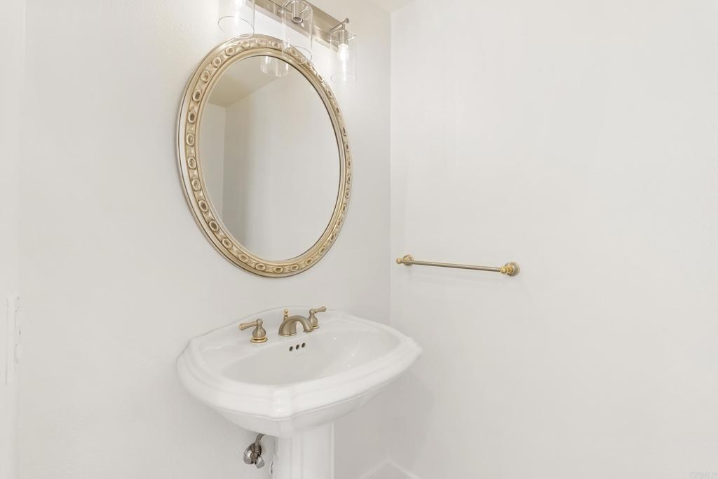 219 Via Osuna Rancho Santa Fe, CA 92091 - Photo 24 of 50 a bathroom with a sink and a mirror