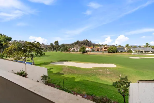 a spacious bathroom with a shower sink and mirror
