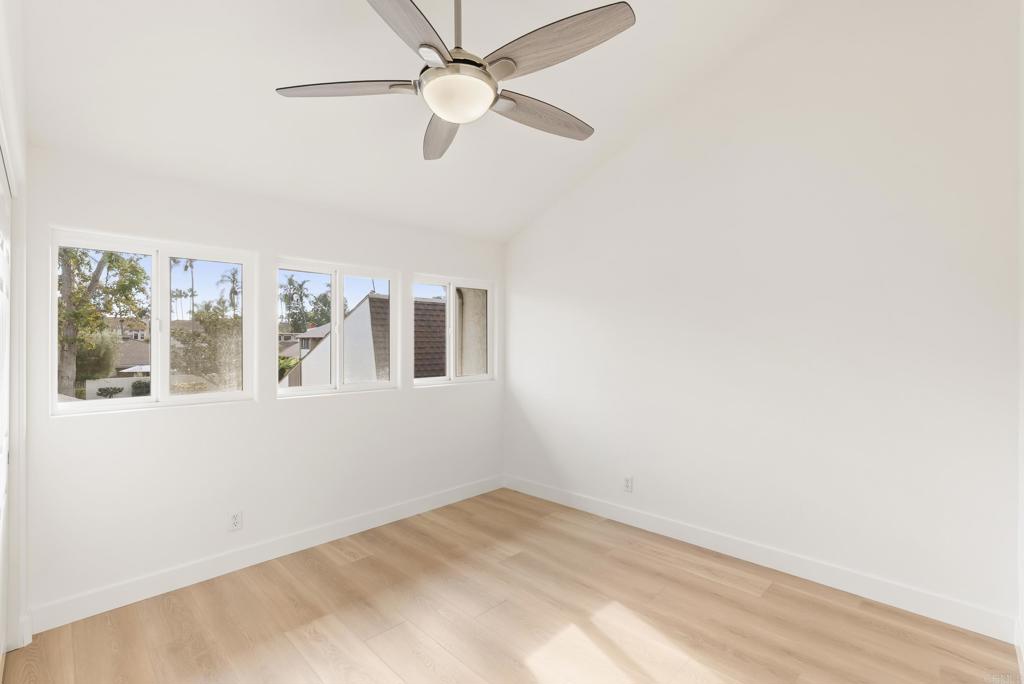 219 Via Osuna Rancho Santa Fe, CA 92091 - Photo 36 of 50 an empty room with windows and fan