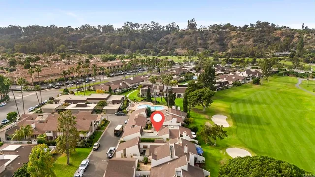 a view of a city with mountains in the background