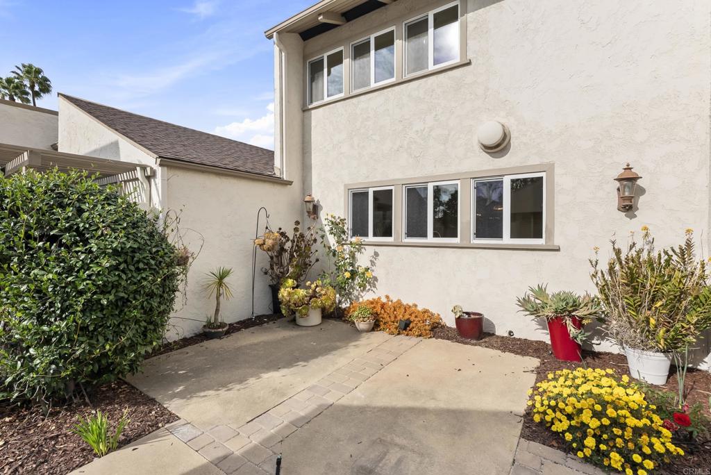 219 Via Osuna Rancho Santa Fe, CA 92091 - Photo 7 of 50 a lot of flowers in front of a white house