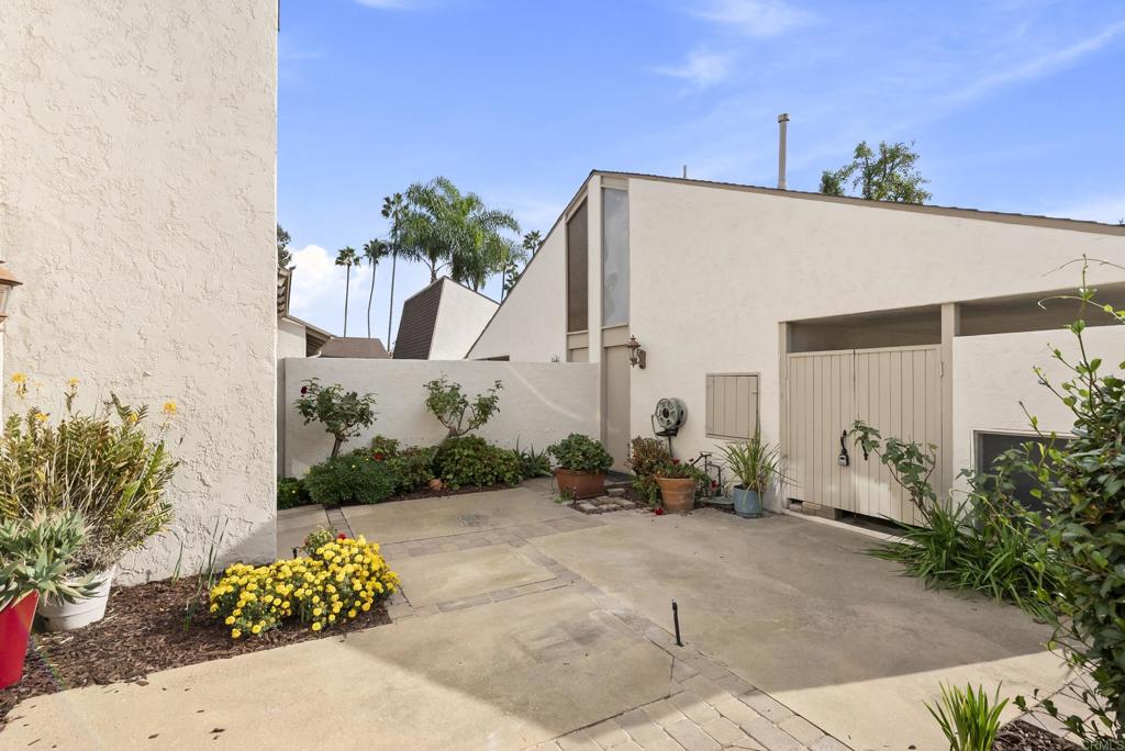 219 Via Osuna Rancho Santa Fe, CA 92091 - Photo 8 of 50 a front view of a house with lots of potted plants