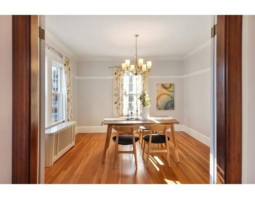 39 Upland Road Arlington, MA 02474 - Photo 11 of 30 a view of a dining room with furniture window and wooden floor