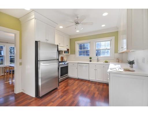 39 Upland Road Arlington, MA 02474 - Photo 15 of 30 a kitchen with a refrigerator sink and cabinets