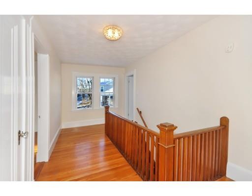 39 Upland Road Arlington, MA 02474 - Photo 23 of 30 a view of a hallway with wooden floor