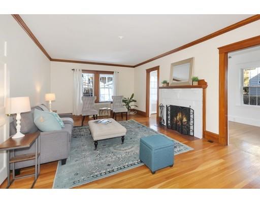 39 Upland Road Arlington, MA 02474 - Photo 5 of 30 a living room with furniture and a fireplace