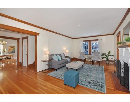 39 Upland Road Arlington, MA 02474 - Photo 6 of 30 a living room with fireplace furniture and a wooden floor