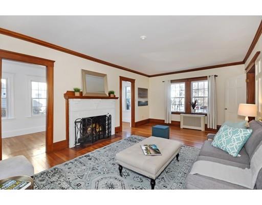39 Upland Road Arlington, MA 02474 - Photo 8 of 30 a living room with furniture and a fireplace