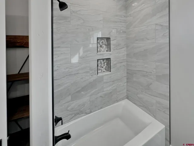 a bathroom with a bathtub