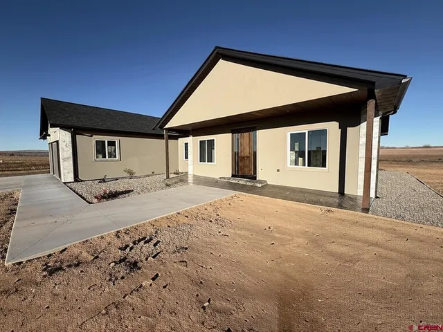 a house with trees in the background