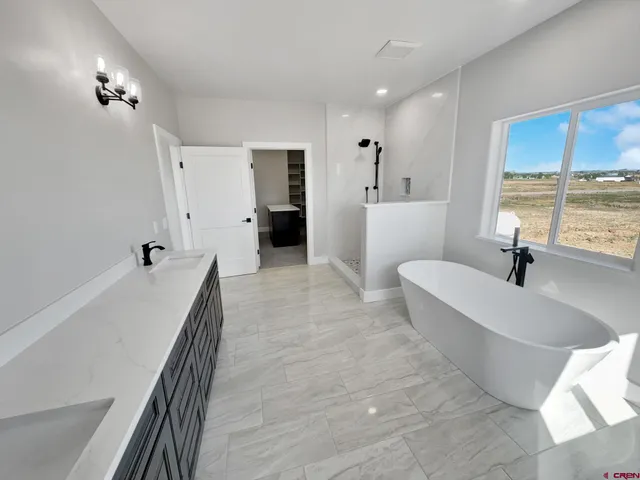 a room with a bed and a dresser