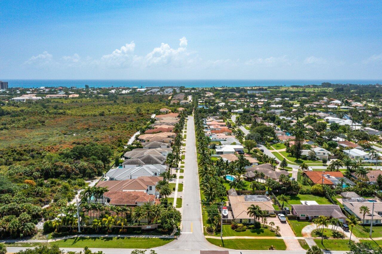 1717 West Hemingway Drive Juno Beach, FL 33408 - Photo 1 of 41 an aerial view of residential houses with outdoor space