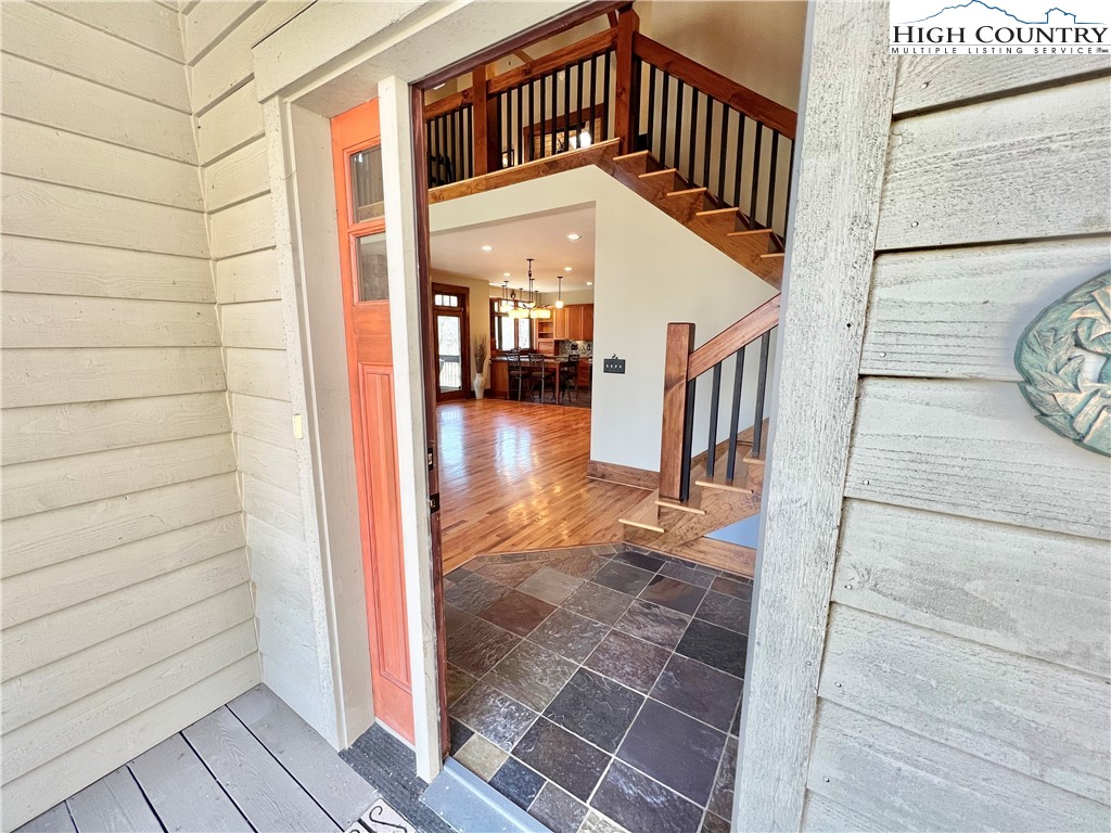 259 The Settlement Boone, NC 28607 - Photo 12 of 50 a view of a hallway with wooden floor and staircase