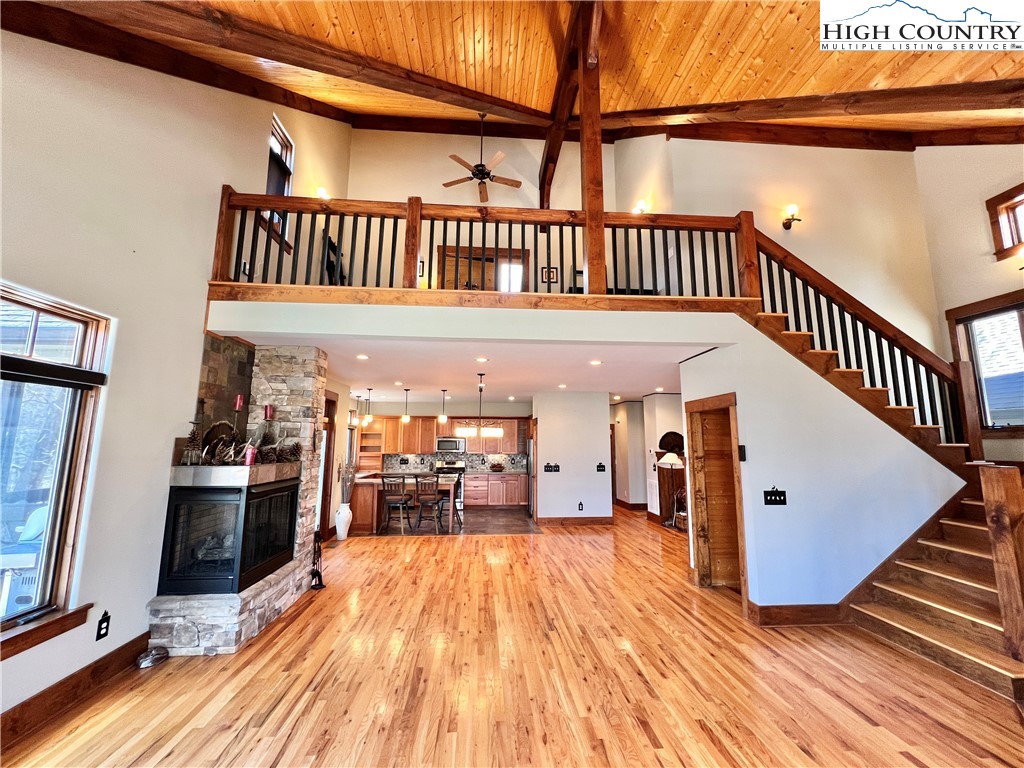 259 The Settlement Boone, NC 28607 - Photo 17 of 50 a view of a hallway with wooden floor and staircase