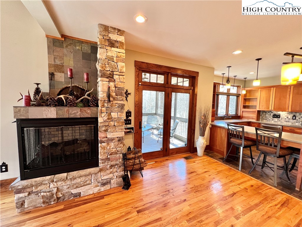 259 The Settlement Boone, NC 28607 - Photo 18 of 50 a living room with fireplace furniture and a wooden floor