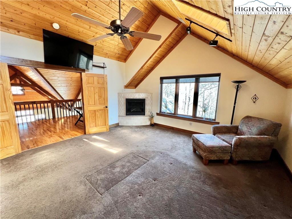 259 The Settlement Boone, NC 28607 - Photo 30 of 50 a living room with furniture and a floor to ceiling window
